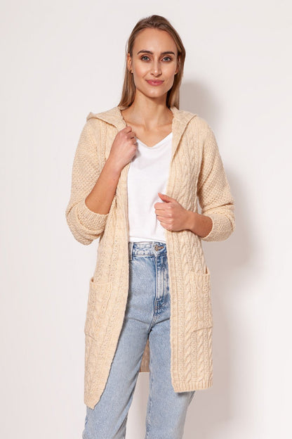Elegant MKM soft cardigan coat in cream, designed with a modern aesthetic, dropped shoulders, and practical hip pockets, presented by a model for a sophisticated look.