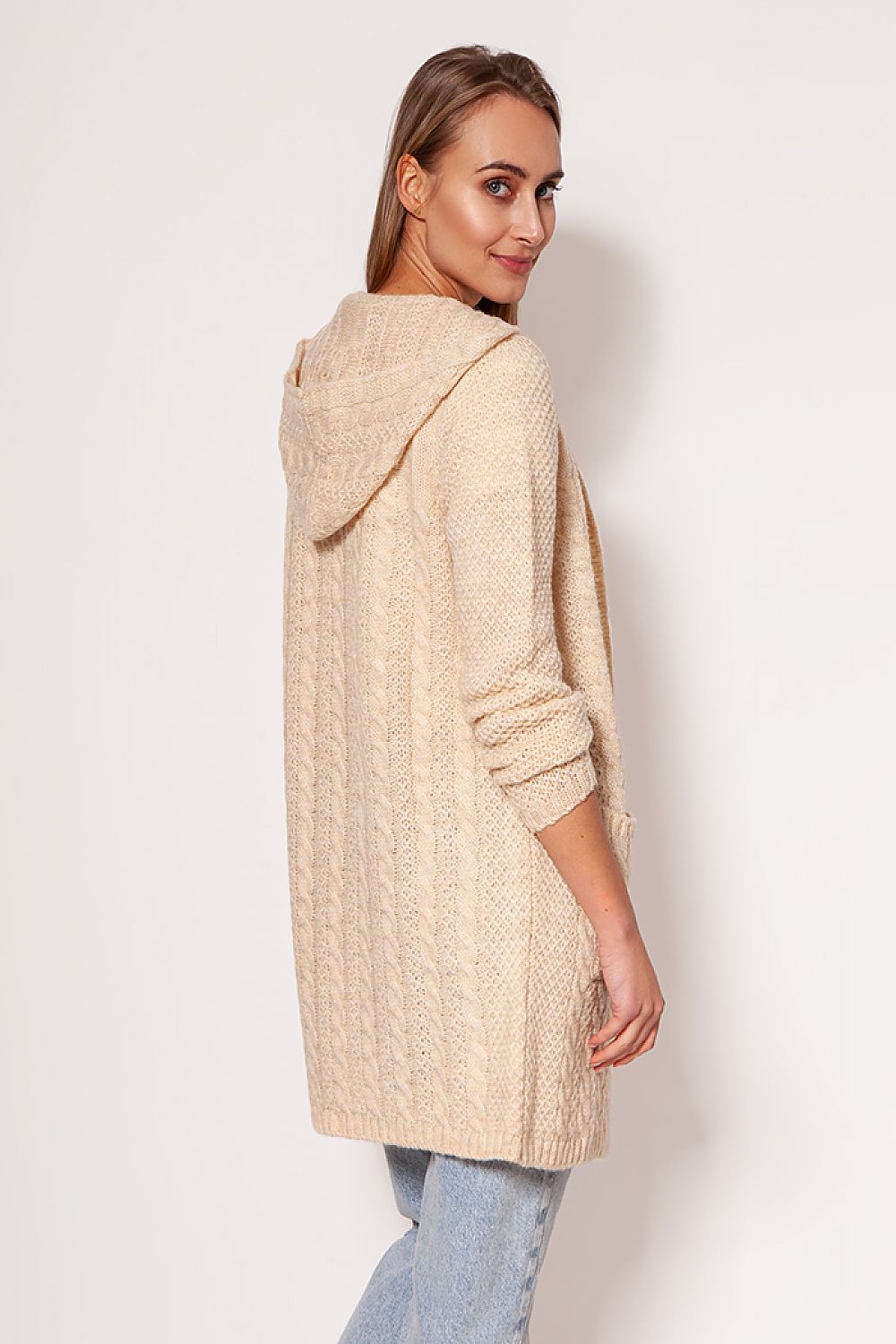 Chic MKM soft cardigan coat in cream, illustrating a minimalist style with dropped shoulders and hip pockets, modelled elegantly to highlight versatility and comfort.