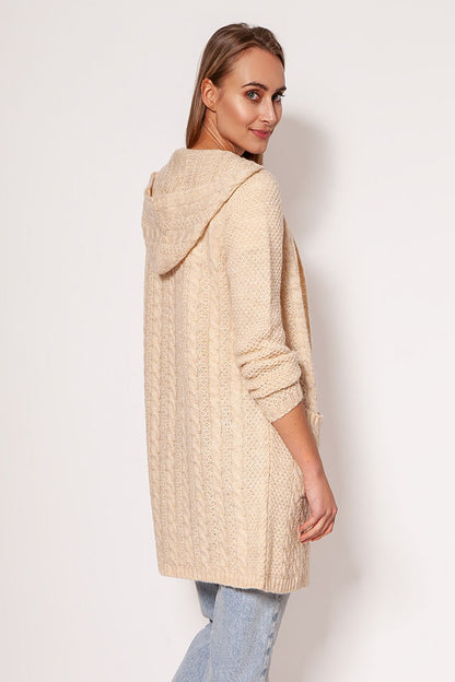 Chic MKM soft cardigan coat in cream, illustrating a minimalist style with dropped shoulders and hip pockets, modelled elegantly to highlight versatility and comfort.