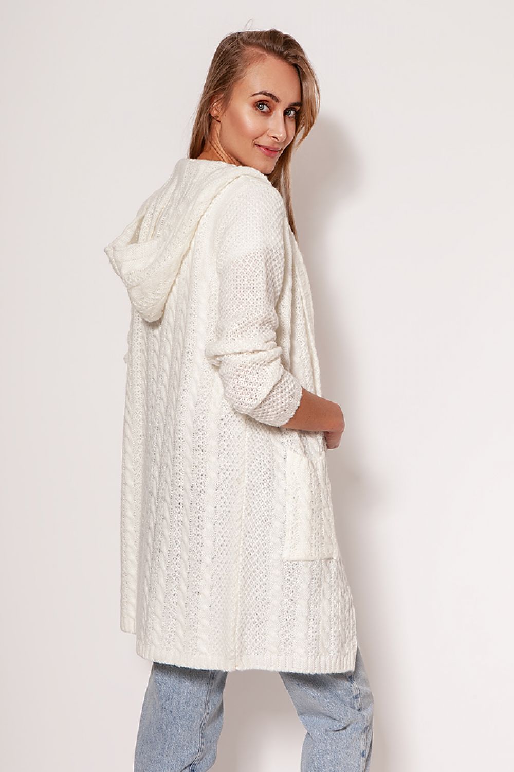 Stunning MKM soft cardigan coat in bright white, showcasing a modern aesthetic with dropped shoulders and hip pockets, presented by a model for a fashionable look.