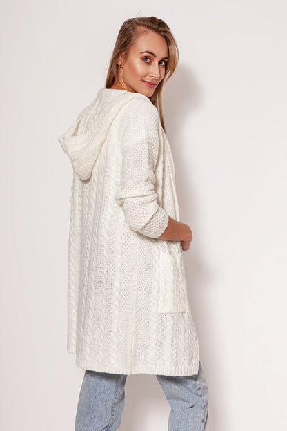 Stunning MKM soft cardigan coat in bright white, showcasing a modern aesthetic with dropped shoulders and hip pockets, presented by a model for a fashionable look.