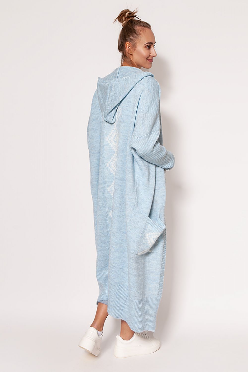 Side view of the MKM light blue extended cut cardigan showcasing its chic design and hood, perfect for stylish layering in any elegant outfit.