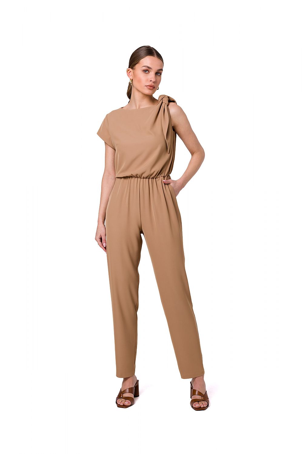 Chic beige one-shoulder jumpsuit with tapered legs and elastic waist from Stylove, presenting a minimalist design with a fashionable shoulder tie detail.