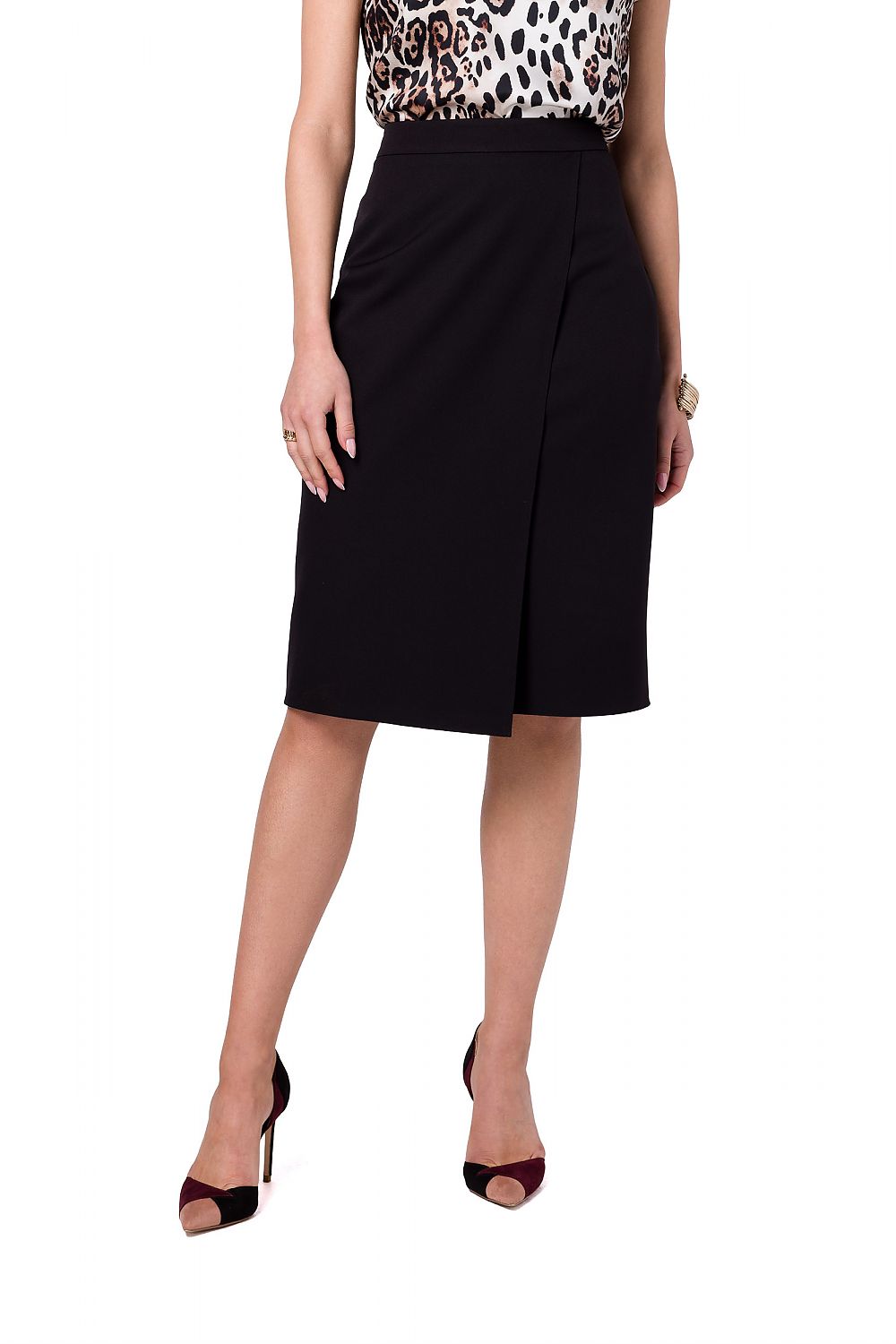 Stylove black A-line skirt featuring an asymmetrical front design, presented with a classy top, a staple for sophisticated wardrobes.