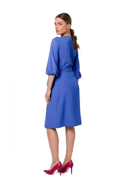 Stylove back view of the luxurious blue flared overlap dress, showcasing wide sleeves and chic waist binding, perfect for fashionable events.