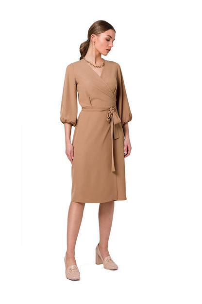 Stylove sophisticated flared overlap dress in a fashionable beige, featuring wide sleeves and an elegant waist tie, perfect for stylish celebrations.