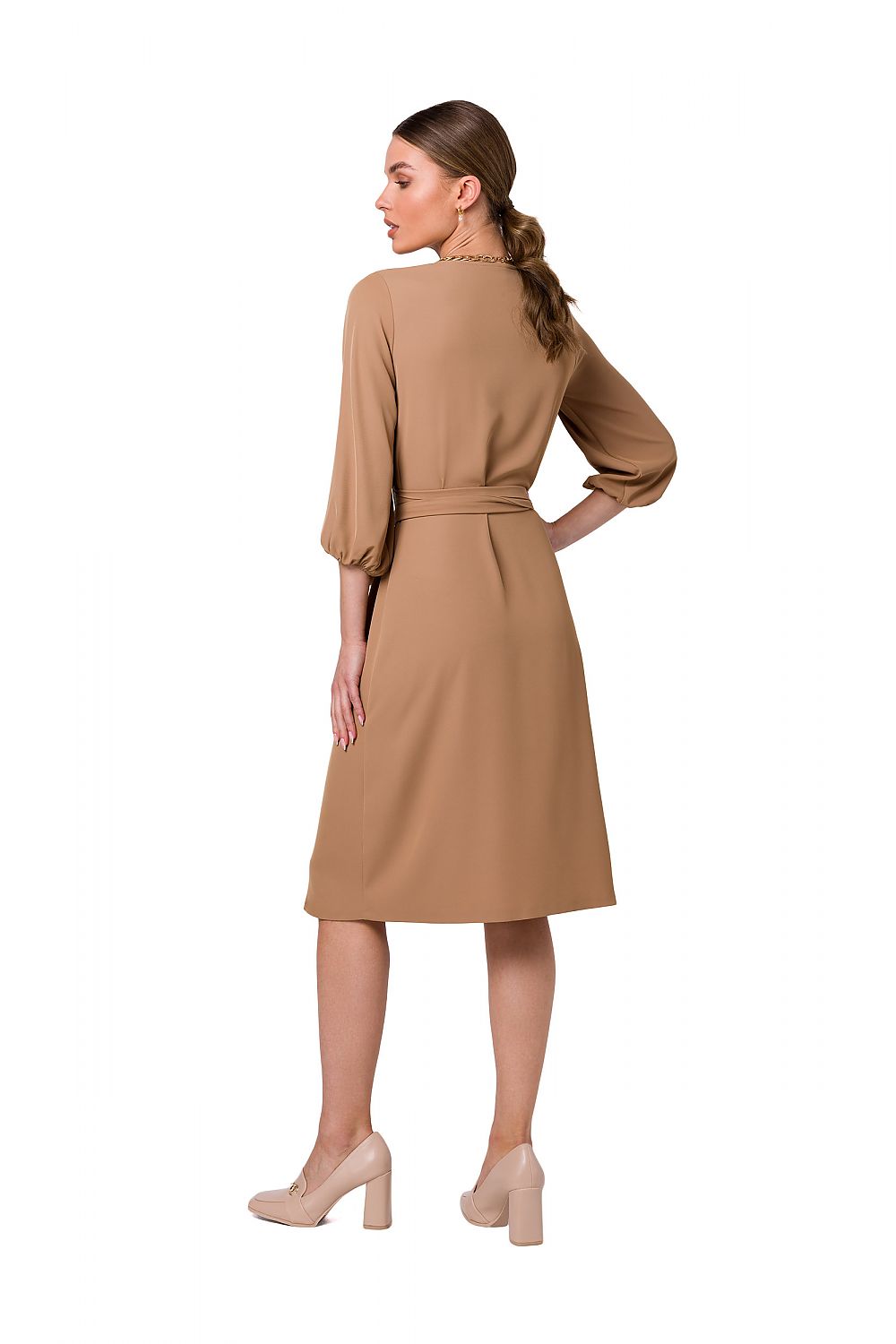Elegant back view of a Stylove flared overlap dress featuring wide sleeves and graceful waist binding, showcasing a sophisticated design in a luxurious beige fabric.
