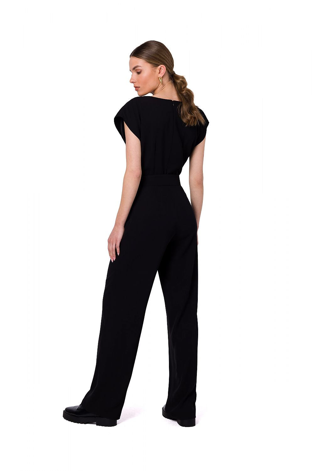 Stylove black jumpsuit displayed from the back, showcasing its sleek design and chic cutout neckline, ideal for sophisticated occasions.