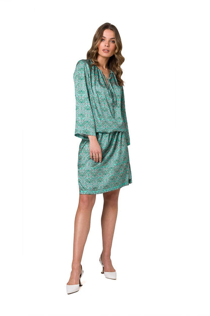 Stylove vibrant green printed kaftan dress with 3/4 sleeves, elegantly styled on a model, perfect for casual luxury outings.