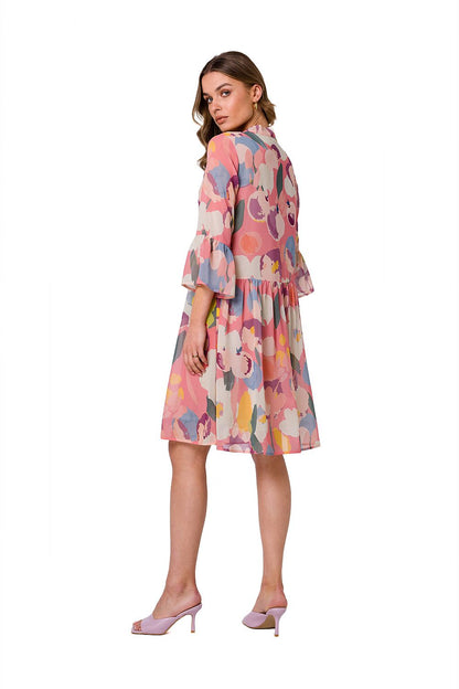 Stylove ethereal chiffon daydress featuring a vibrant, abstract floral pattern with elbow-length sleeves, elegantly styled for a sophisticated look.