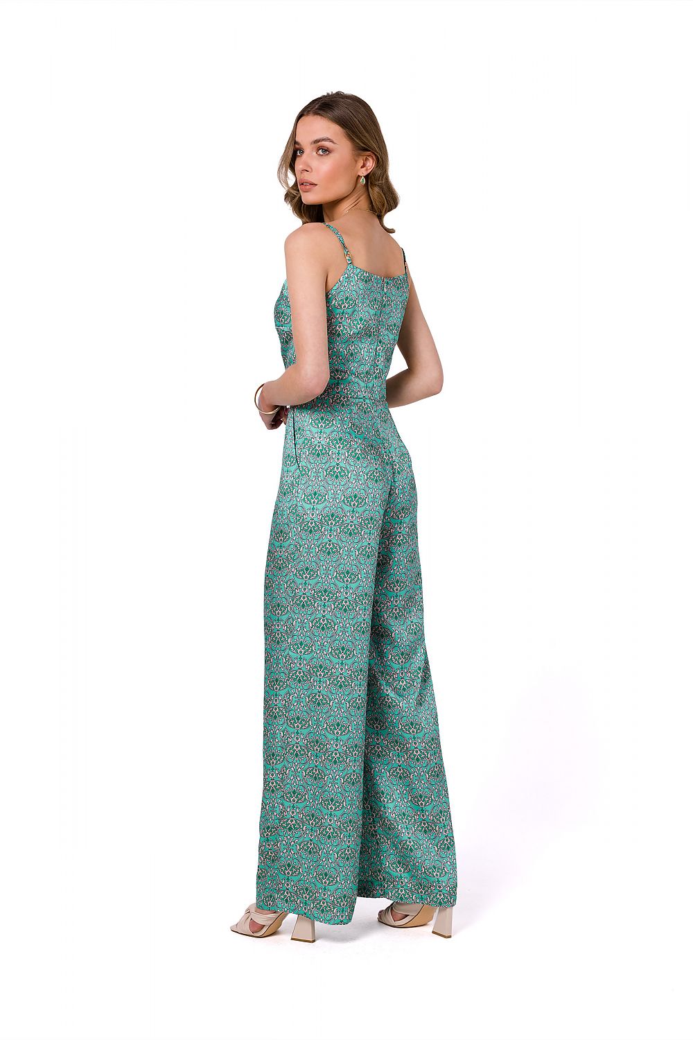 Stylove summer satin print suit with thin straps, elegantly designed with a lined top and side pockets, showcasing a model from behind, wearing a vibrant green patterned jumpsuit that epitomizes chic summer sophistication.