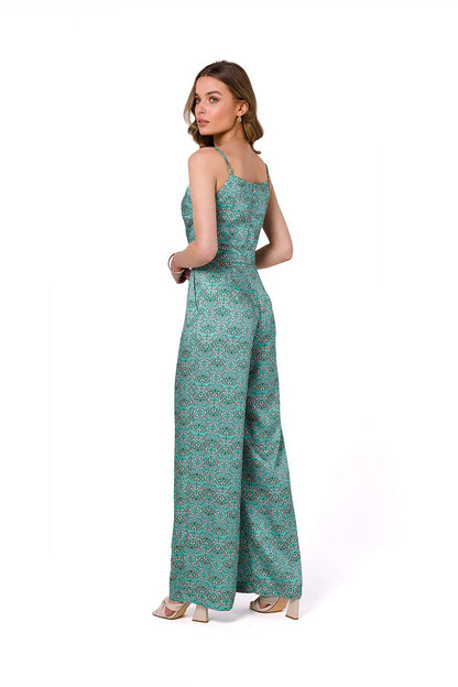 Stylove summer satin print suit with thin straps, elegantly designed with a lined top and side pockets, showcasing a model from behind, wearing a vibrant green patterned jumpsuit that epitomizes chic summer sophistication.