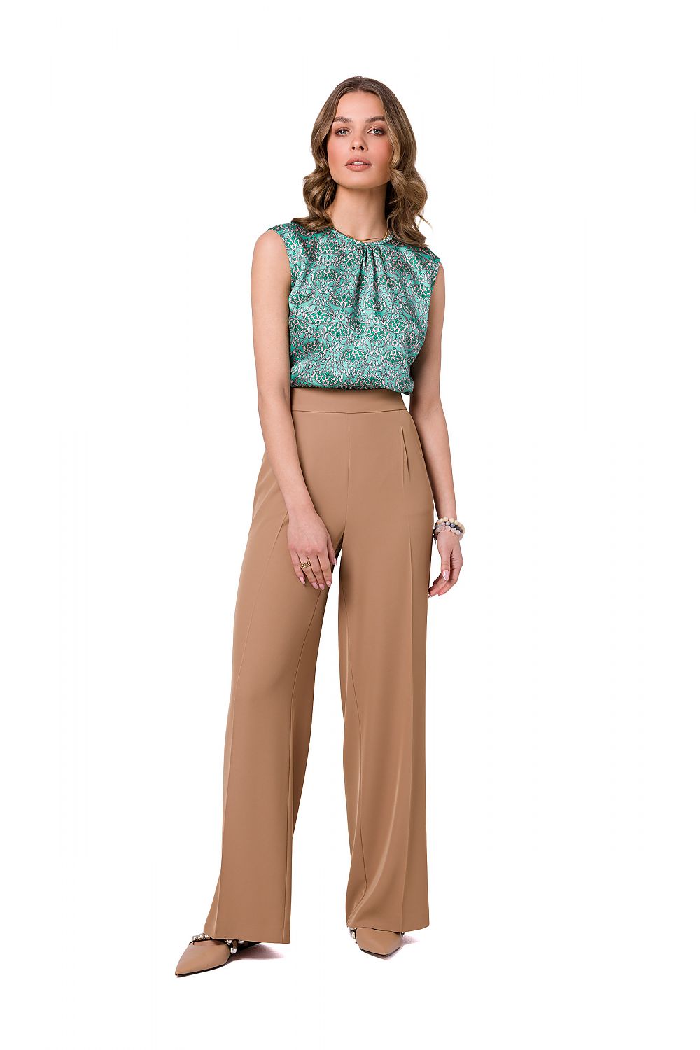 Sophisticated beige wide leg trousers by Stylove, styled with a patterned top, presenting a contemporary and luxurious outfit for modern women.
