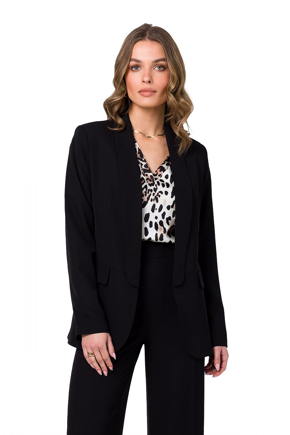 Sophisticated black unbuttoned blazer presented by Stylove, styled with a chic patterned blouse, exuding luxury and modern elegance.