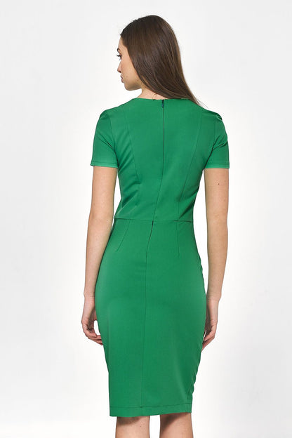 Chic detailed back view of the Nife Minimalist Daydress in vibrant green, highlighting its tailored fit and seamless design for versatile styling.