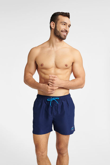 Stylish Henderson GUARD navy blue swimming trunks for men, showcasing a minimalist design with an adjustable fit, perfect for beach relaxation and water activities.