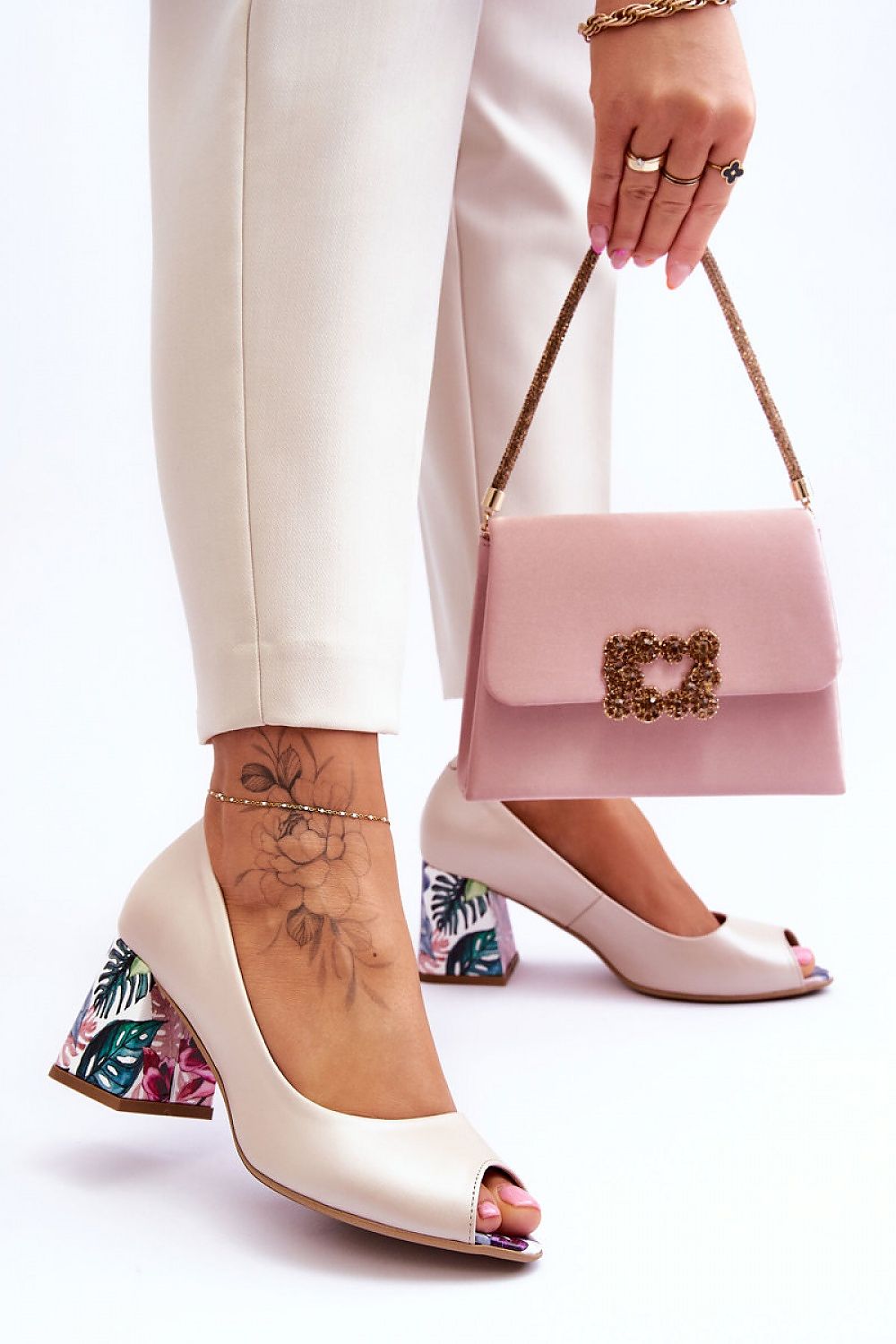 Sophisticated natural leather pumps with almond toe design from Step In Style, featuring a trendy block heel with floral detail, perfect for an elegant outing.