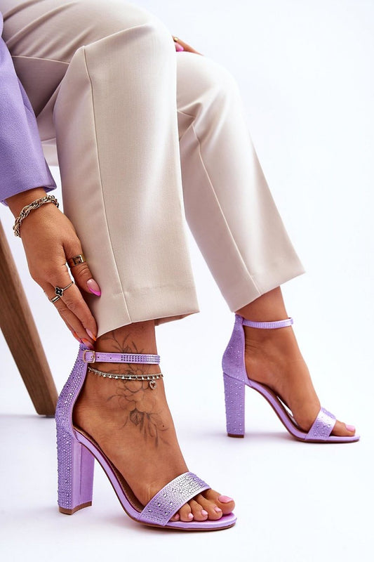 Close-up view of sophisticated purple high heel sandals with intricate design and adjustable buckle, designed for women by Step in Style.