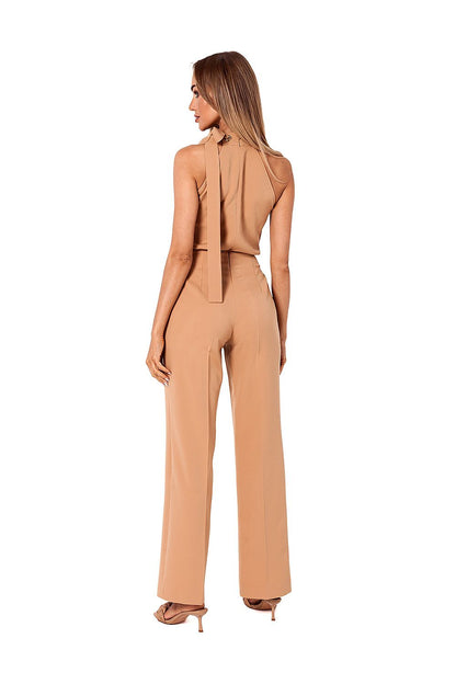 Back view of the stylish nude halter neck pantsuit by Moe, highlighting the elegant tie detail and contemporary style.