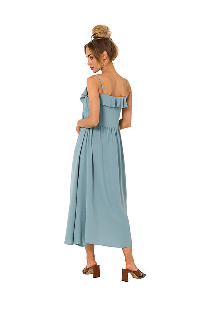 Sophisticated back view of Moe's loose-fitting midi dress in pastel blue, showcasing beautiful ruffled details and comfort for elegant occasions.