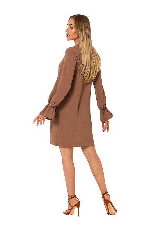 Elegant view of the back of a long sleeve dress by Moe, highlighting the ruffled sleeves and sleek design, complemented by chic footwear.