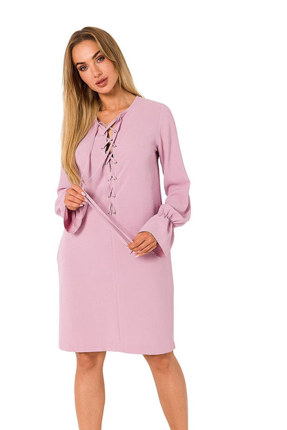Fashionable pink long sleeve dress by Moe with refined lace detailing at the neckline, an exquisite addition to any wardrobe.