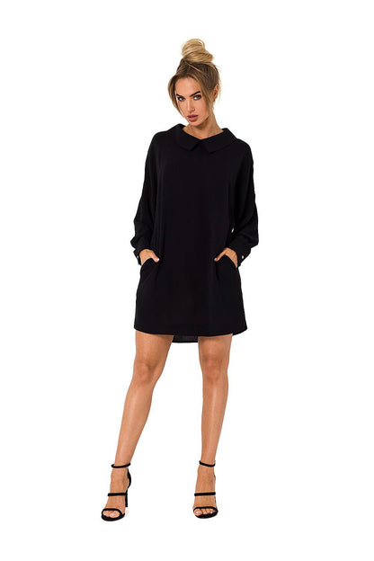 Chic black luxury Moe daydress with a classic collar design and long sleeves, ideal for sophisticated outings.