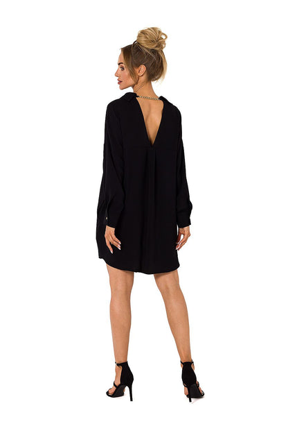 Back view of a black luxury Moe daydress highlighting a unique chain detail at the neckline.