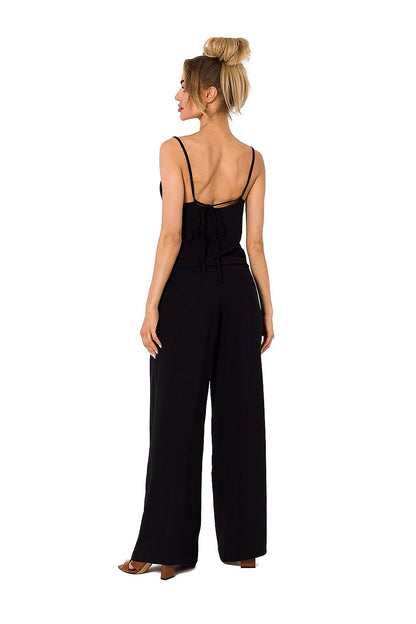 Elegant black draped neckline pantsuit featuring thin straps and slip pockets, designed by Moe, perfect for sophisticated occasions.