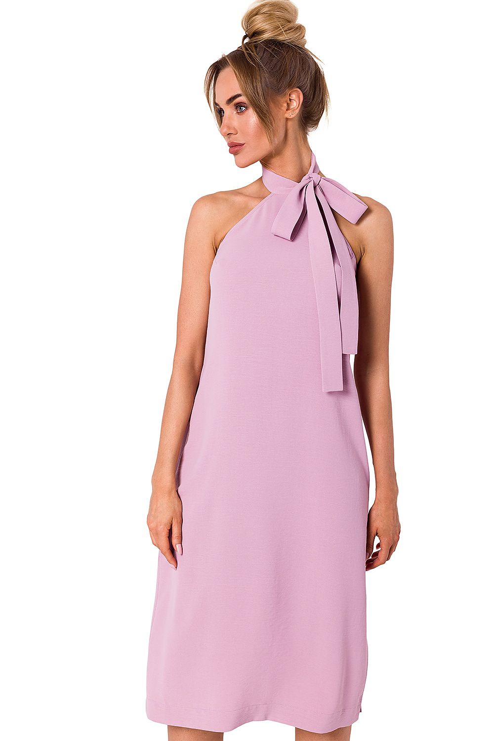 A model highlights a luxurious pink halter neck crepe daydress with an open back, perfectly blending elegance and comfort, by Moe.