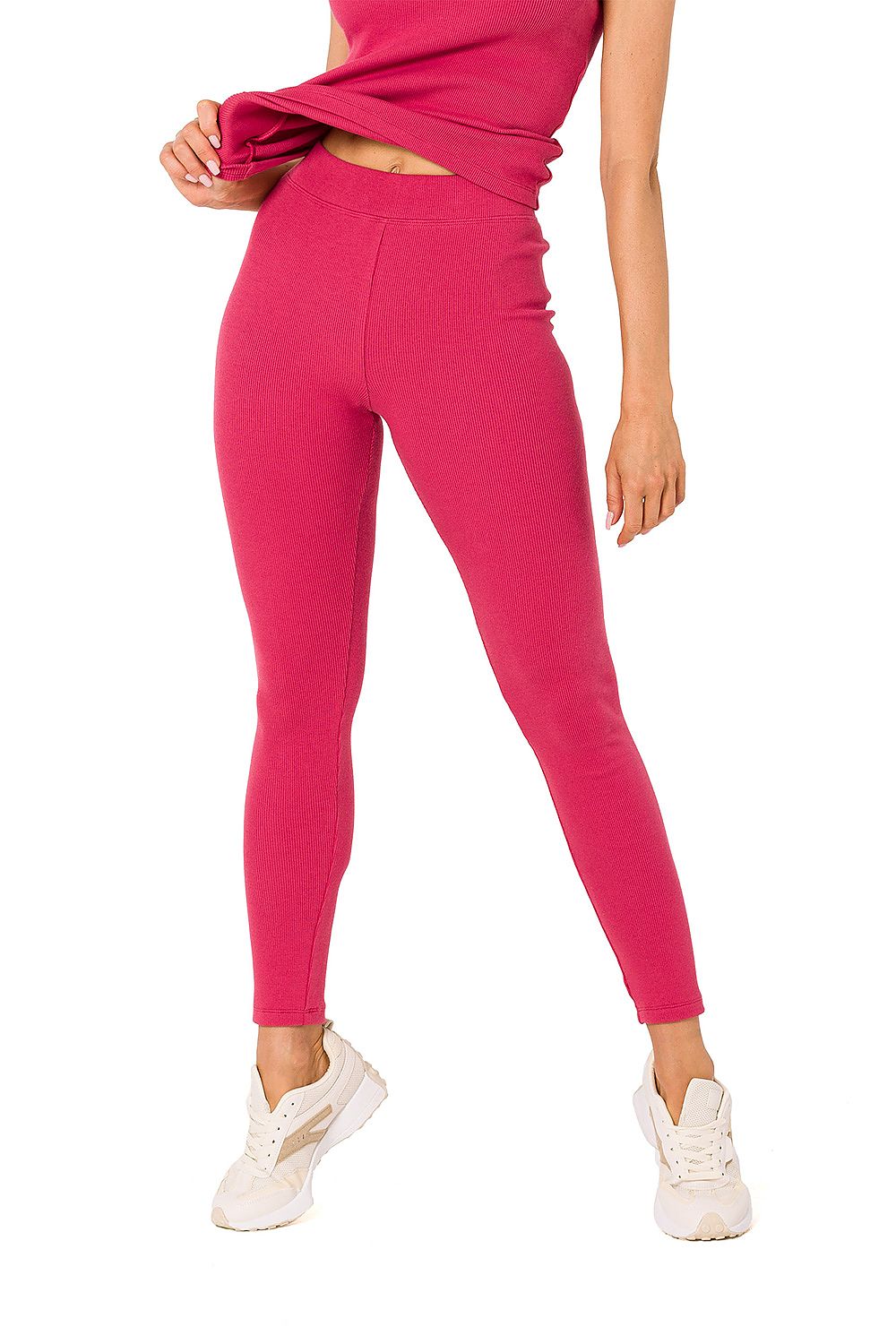 Moe luxurious ribbed knit leggings in chic pink, styled with a matching top for an attractive casual ensemble.