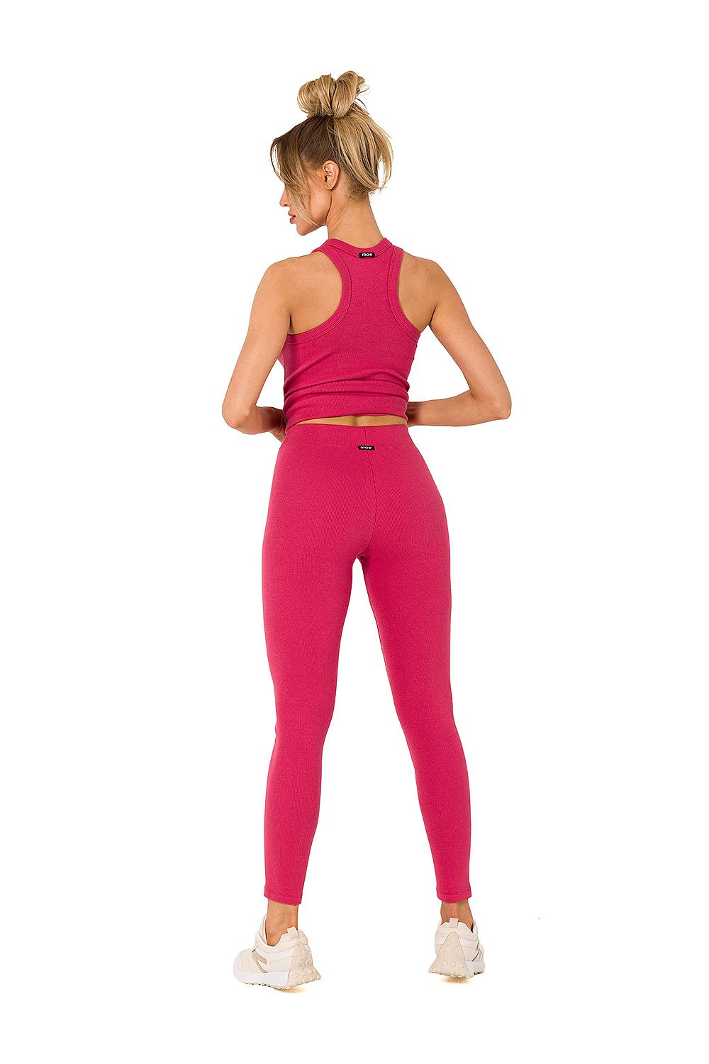 Stylish Moe ribbed knit leggings in vivid pink, featured with a matching cropped tank top, showcasing a luxurious look perfect for everyday comfort.
