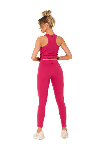 Stylish Moe ribbed knit leggings in vivid pink, featured with a matching cropped tank top, showcasing a luxurious look perfect for everyday comfort.