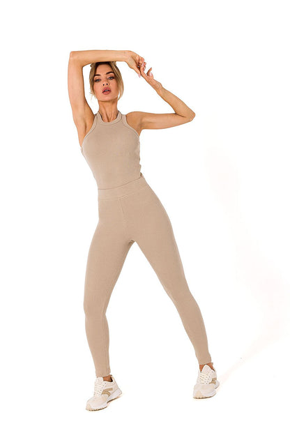 Stylish ribbed knit leggings from Moe, paired with a matching sleeveless top, showcasing a high-fashion look.