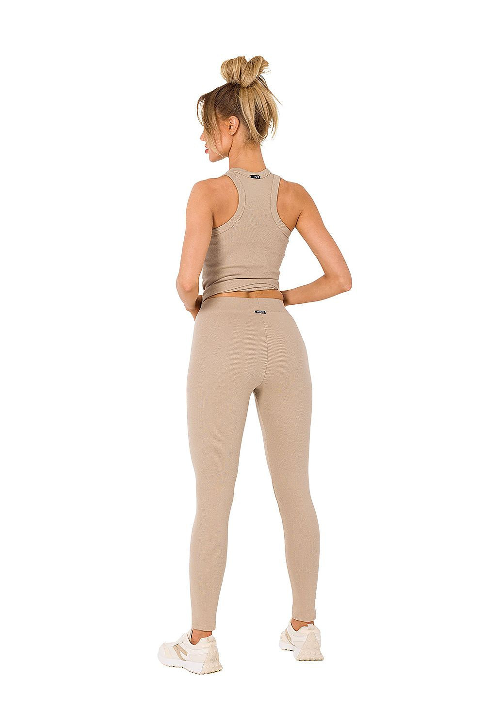 Chic rear view of Moe's ribbed knit leggings styled with a coordinating top, reflecting a trendy silhouette.
