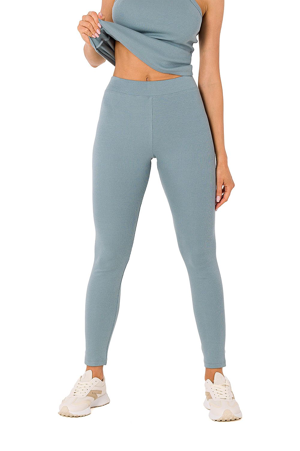 Elegant light blue ribbed knit leggings by Moe, expertly combined with a fitted top for a complete luxury outfit.