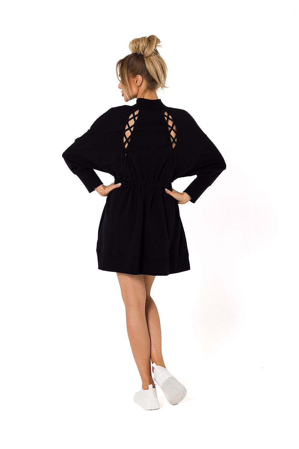 Elegant rear view of a black daydress showcasing stylish cutout details, designed for comfort and fashion by Moe.