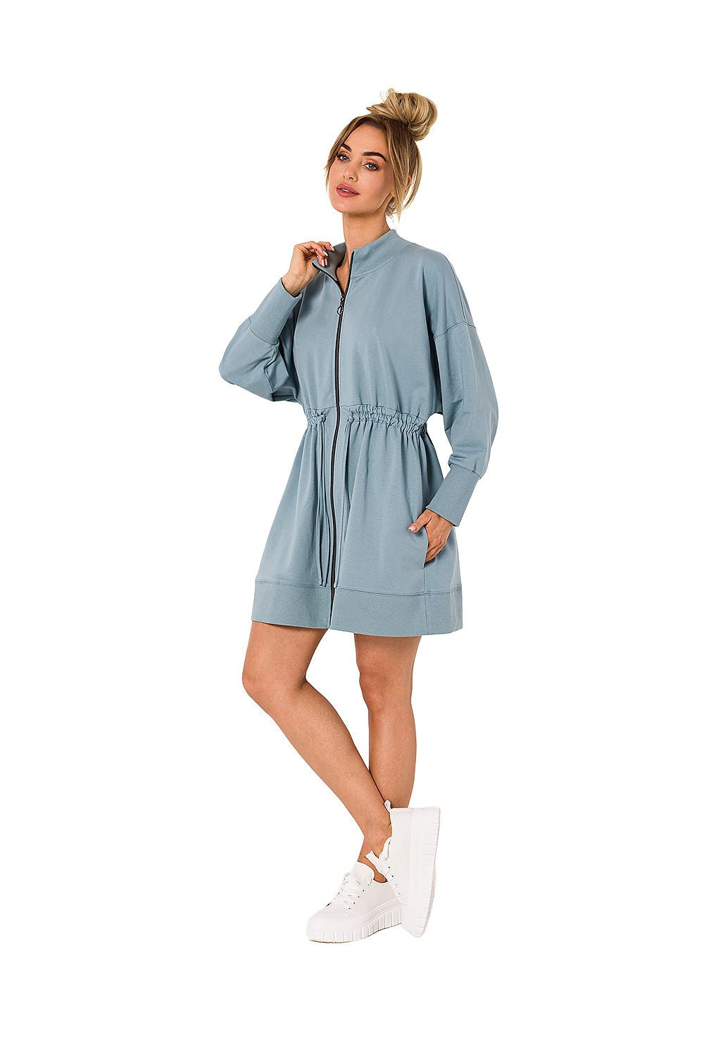 Chic zippered daydress by Moe in a soft blue hue, featuring stylish cutouts and lacing, perfect for creating a sophisticated and fashionable look.