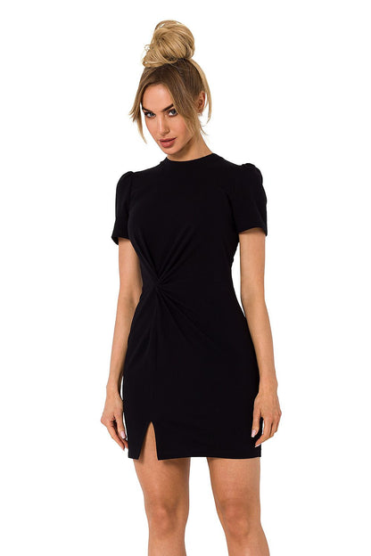 Front view of Moe mini cotton dress in classic black, featuring a stylish twist front and short sleeves, an essential piece for luxury summer attire.