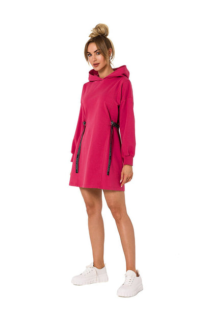 Moe luxury cotton-blend mini dress in vibrant pink, featuring a hood and long sleeves, styled with a sleek silhouette and tied at the waist.