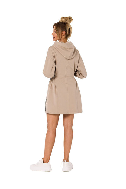 Rear view of Moe luxury cotton-blend mini dress with hood and long sleeves, showcasing the elegant design in beige, perfect for casual outings.
