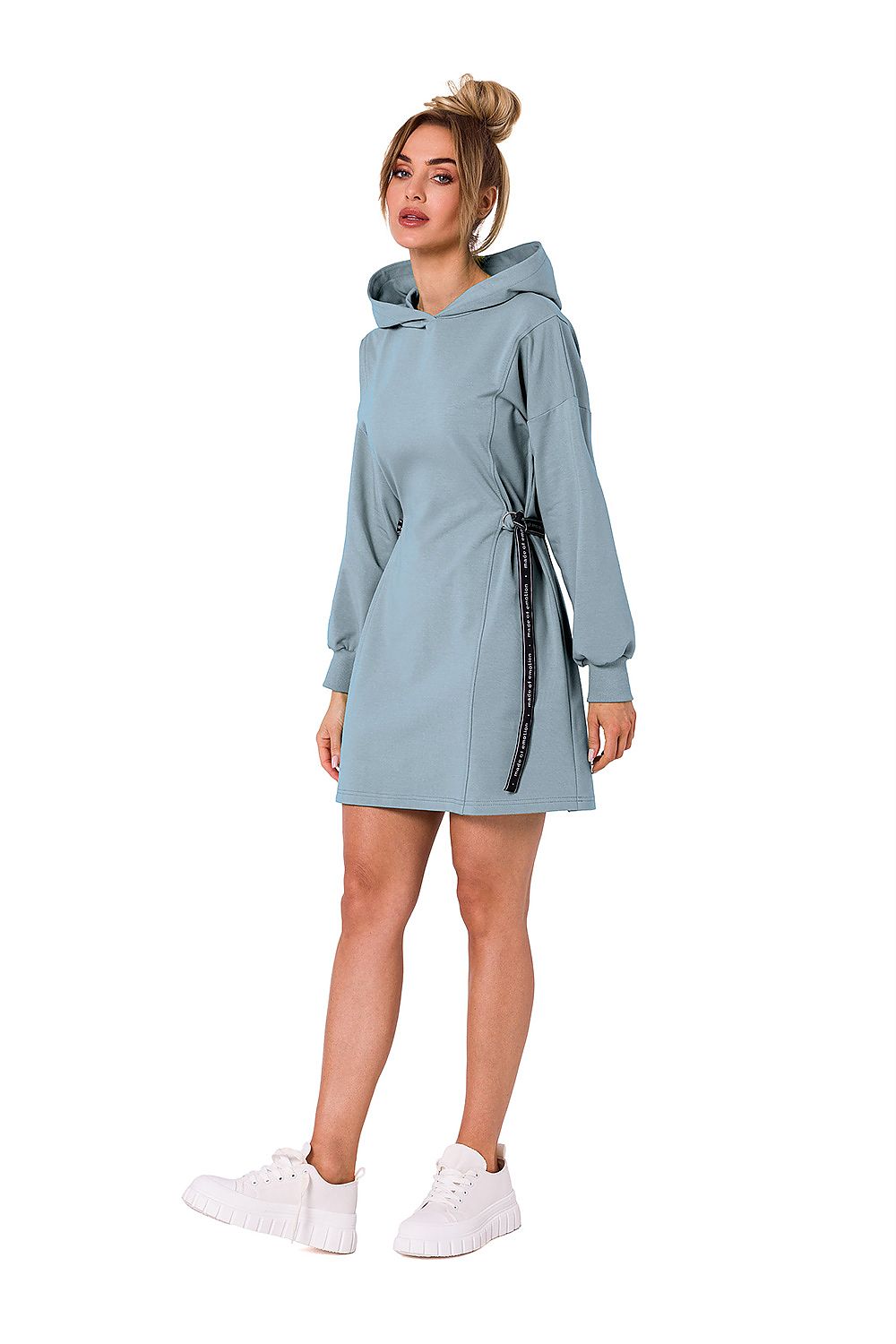 Moe luxury cotton-blend mini dress in a calming blue tone, styled with white sneakers, highlighting its fashion-forward appeal and versatility.