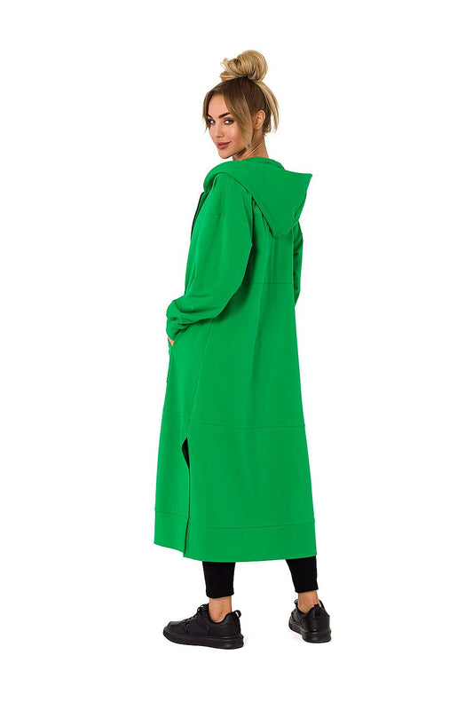Luxurious green hooded sweatshirt by Moe, designed for cold days, showcasing a model from the back with a relaxed fit and practical side pockets.
