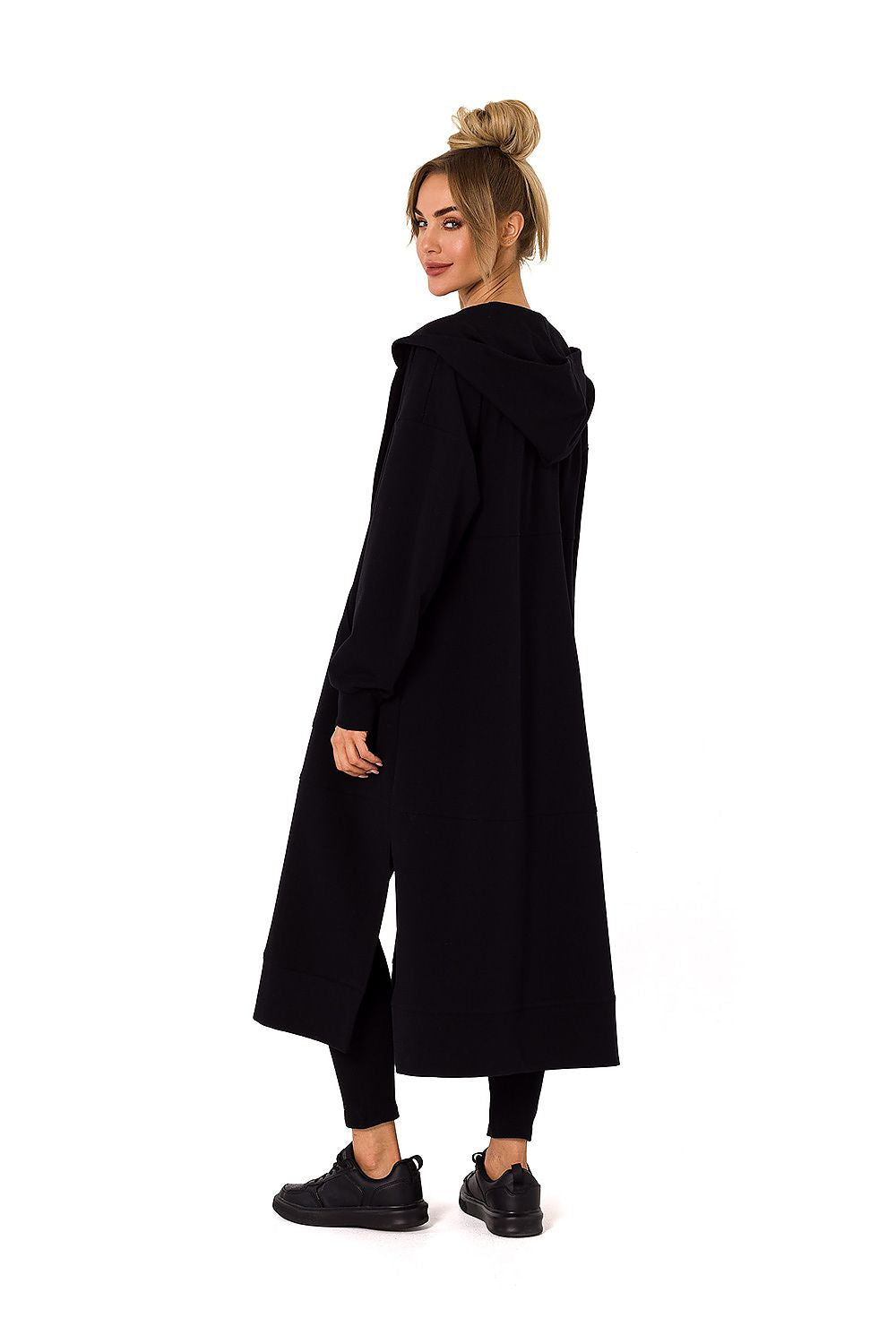 Sophisticated black hooded sweatshirt by Moe, showcasing a model from the back, combining functionality and luxury for the ultimate cold weather fashion.