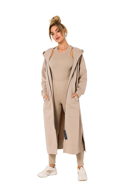Luxurious hooded sweatshirt by Moe in elegant beige, showcasing a stylish and comfortable fit, perfect for cold days, featuring pockets.