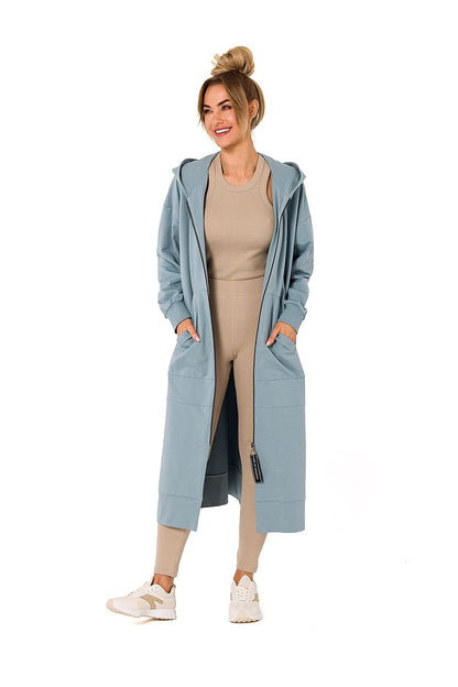 Stunning light blue hooded sweatshirt by Moe, offering a sophisticated and comfy look for cold weather, complete with pockets and a modern design.