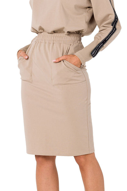 Chic Moe Women's beige knit sweatshirt skirt with practical pockets and an elastic waistband, a versatile piece for any wardrobe.
