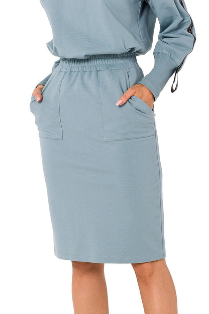 Close-up of Moe women's knit sweatshirt skirt in soft blue, showcasing the stylish front pockets and elastic waistband.