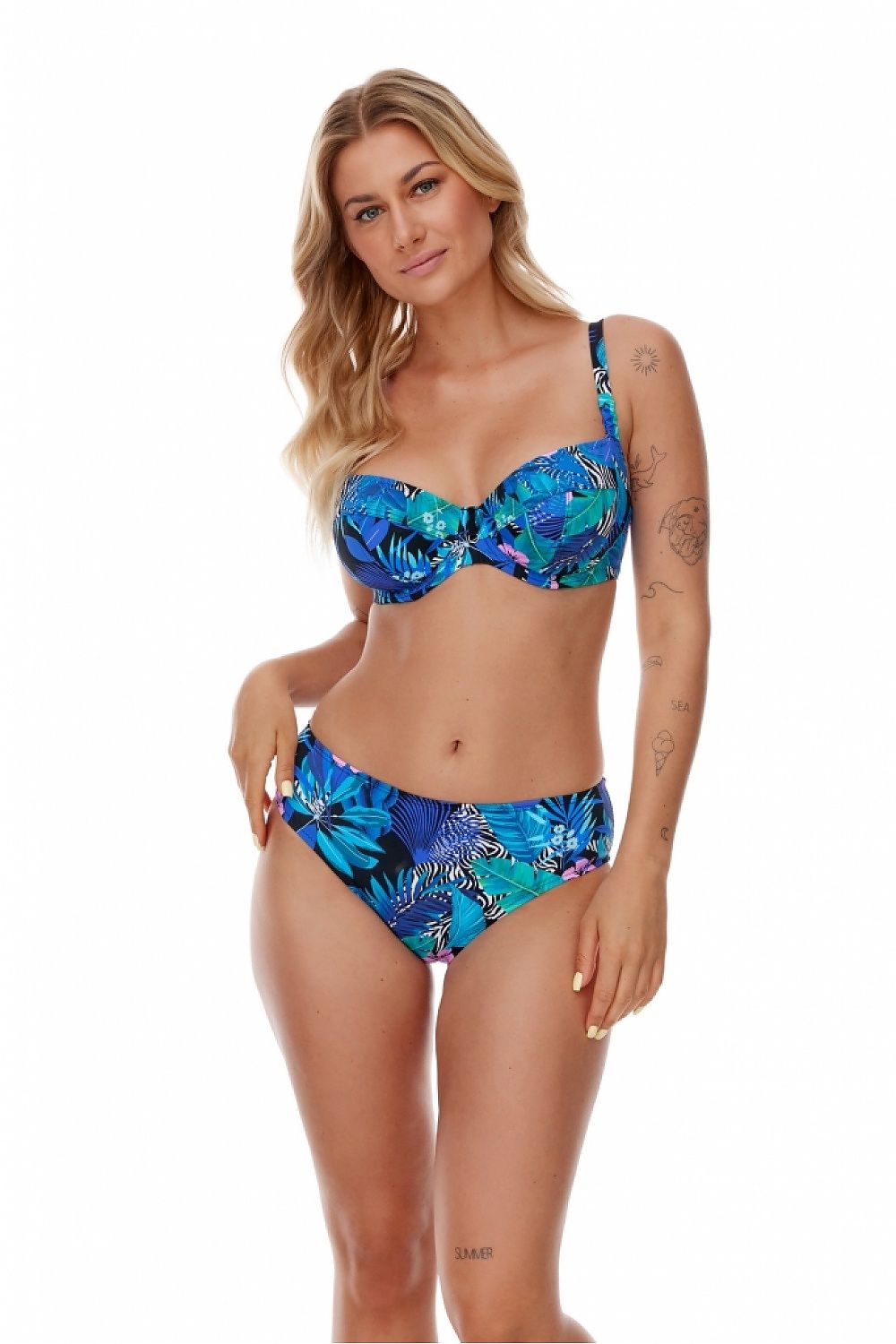 Model showcasing luxury high-waisted swimming panties with a vibrant zebra and exotic leaves motif in blue by Lupo Line, exuding elegance and sophistication for summer fashion.