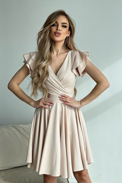 Gorgeous Bicotone cocktail dress in a light beige shade, accentuated by ruffled sleeves and a tailored design for a luxurious look.